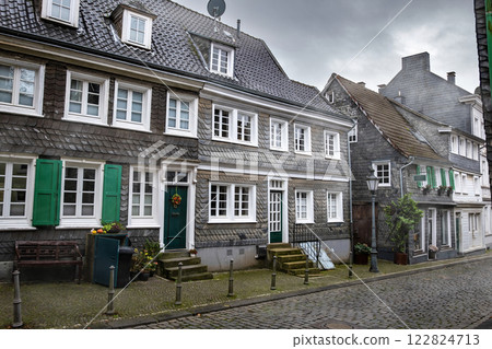 Slate houses in beautiful sightseeing of Solingen Greaufrath in Germany, haze autumn morning 122824713