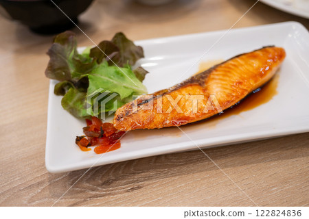 Grilled salmon dish restaurant kitchen food casual dining close-up culinary art 122824836