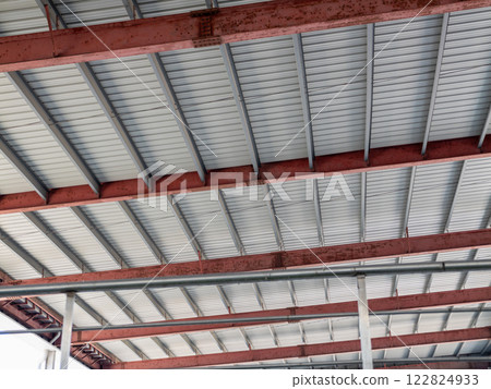 Industrial architecture steel beams and structure warehouse interior urban environment upward view 122824933