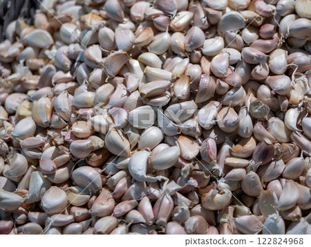 Harvesting garlic cloves local market food vibrant setting close-up view culinary delight 122824968