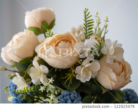 Delicate floral arrangement indoor setting photography natural light close-up beauty concept 122825076
