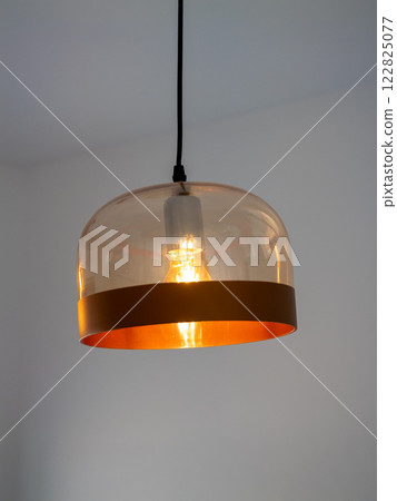 Elegant pendant light fixture modern interior home decor warm ambiance minimalist design 122825077