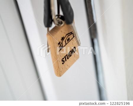 Unlocking creativity studio key on vintage holder creative space indoor close-up artistry 122825196