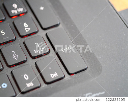 Keyboard enter key close-up office workspace macro photography indoor top view technology concept 122825205
