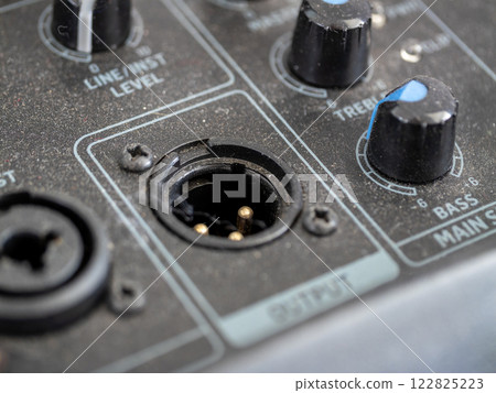 Inspecting audio equipment components studio setting close-up photography technical environment 122825223