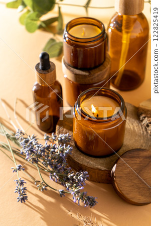 Soy candles in a glass jar. Aromatherapy. Burning candle and lavender. Soy candles in a glass jar. Aromatherapy. Burning candle and lavender. 122825419