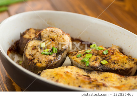 Baked fish with lemon and herbs Baked fish with lemon and herbs 122825463