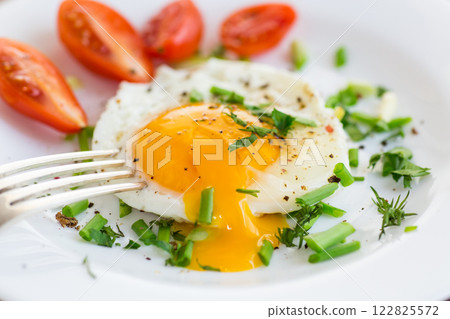 Fresh breakfast with egg, greens and spices 122825572