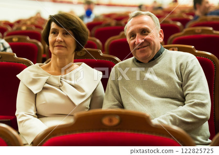 Elderly couple watching play in the theater 122825725
