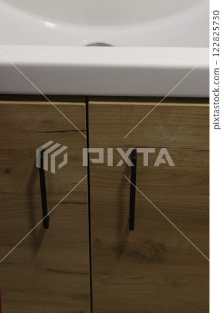 Shot of the cabinet under the sink in the bathroom Shot of the cabinet under the sink in the bathroom 122825730