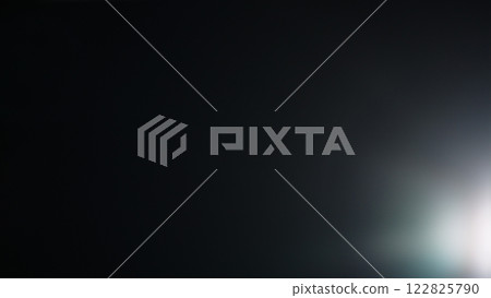 Real optic lens flare over black background for overlay or background Real optic lens flare over black background for overlay or background 122825790