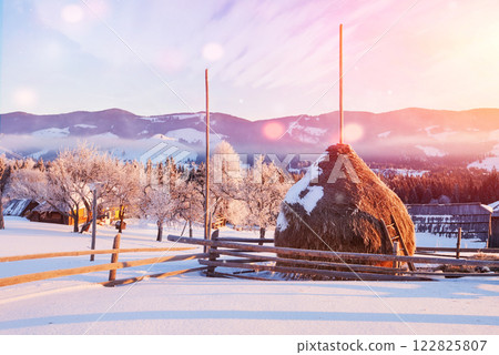 Amazing mountains in the morning sunlight. Small cozy village. Carpathian, Ukraine, Europe. Beauty world. Happy New Year Amazing mountains in the morning sunlight. Small cozy village. Carpathian, Ukraine, Europe. Beauty world. Happy New Year 122825807