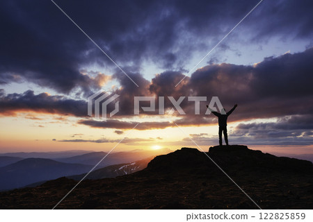 Silhouette of man praying over beautiful sky background Silhouette of man praying over beautiful sky background 122825859