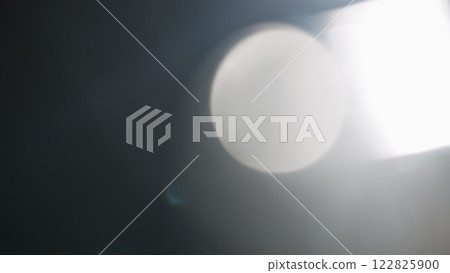 Real lens flare from optics with bokeh and obstruction on foreground 122825900
