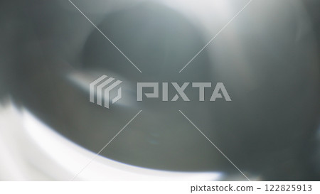 Real lens flare from optics with bokeh and obstruction on foreground Real lens flare from optics with bokeh and obstruction on foreground 122825913