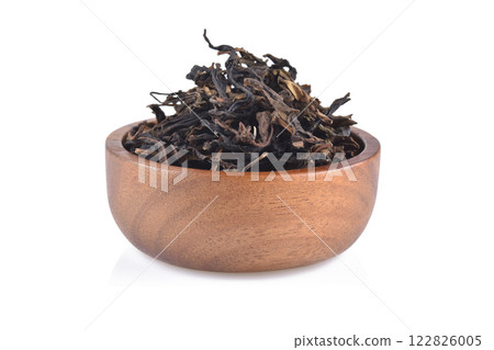 Dry tea leaves isolated on white background. Dry tea leaves isolated on white background. 122826005