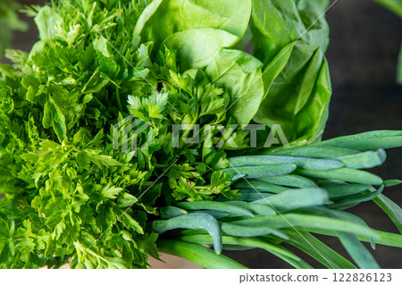 Green onions, spinach, parsley and dill. Vitamin food. Prepare greens for salad. Green onions, spinach, parsley and dill. Vitamin food. Prepare greens for salad. 122826123