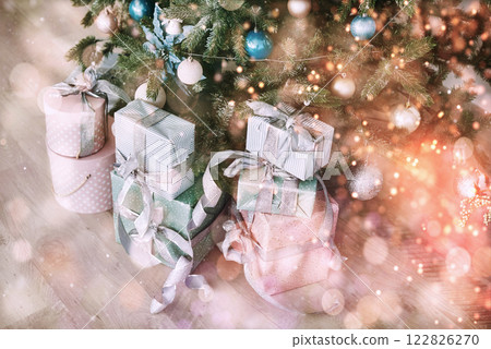 Christmas tree with wooden rustic decorations and presents under it in loft interior. Happy New Year and Christmas. Bokeh light soft effect Christmas tree with wooden rustic decorations and presents under it in loft interior. Happy New Year and Christmas. Bokeh light soft effect 122826270