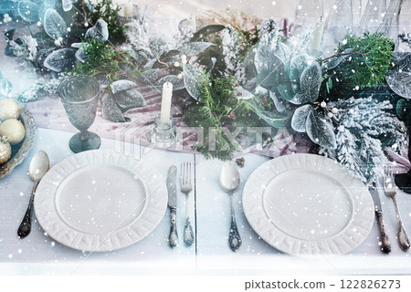Table served for Christmas dinner in living room, top view. Bokeh light soft effect Table served for Christmas dinner in living room, top view. Bokeh light soft effect 122826273