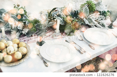 Table served for Christmas dinner in living room, top view. Bokeh light soft effect 122826276