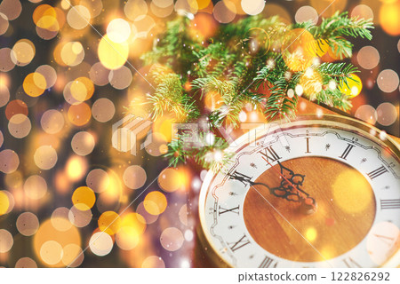 Happy New Year at midnight 2018, Old wooden clock with holiday lights and fir branches 122826292