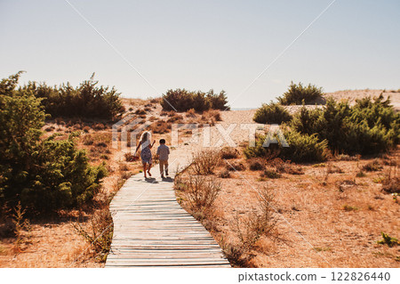 Road to the sea between the dunes 122826440