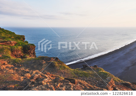 Fantastic beach in southern Iceland, black sand lava. The picturesque sunset Fantastic beach in southern Iceland, black sand lava. The picturesque sunset 122826618