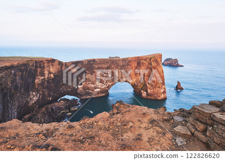 Cape Dyrholaey at southern Iceland. Altitude 120 m, and mean hill island with a door opening 122826620