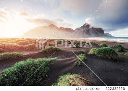 Fantastic west of the mountains and volcanic lava sand dunes on the beach Stokksness, Iceland Fantastic west of the mountains and volcanic lava sand dunes on the beach Stokksness, Iceland 122826630