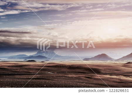 Beautiful landscape of mountain in Iceland with volcano in the background Beautiful landscape of mountain in Iceland with volcano in the background 122826631
