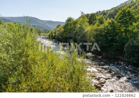 Mountain river. Flow of water over stones. Cascades. Mountain river. Flow of water over stones. Cascades. 122826662