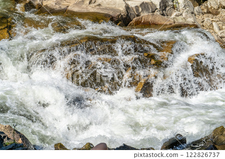 Mountain river. Flow of water over stones. Cascades. Mountain river. Flow of water over stones. Cascades. 122826737