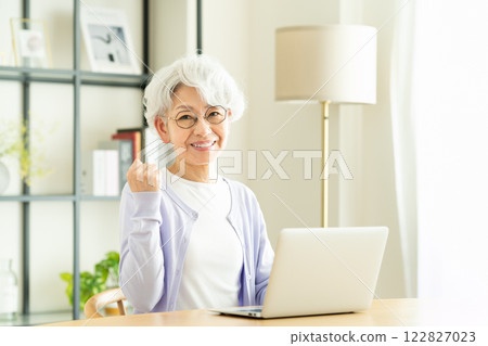 Senior woman working hard on a computer Senior woman working hard on a computer 122827023