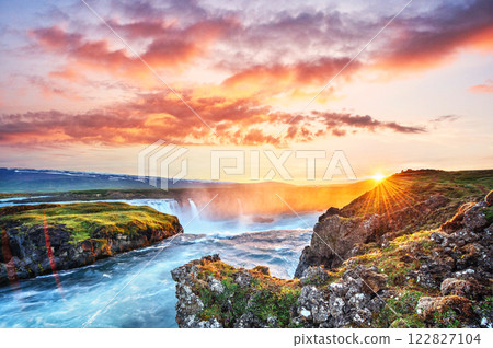 The picturesque sunset over landscapes and waterfalls. Kirkjufell mountain 122827104