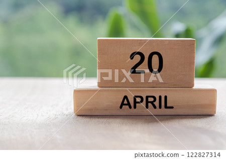 20 April calendar on wooden table with customizable space for text, ideas or messages. Calendar and copy. space concept 122827314