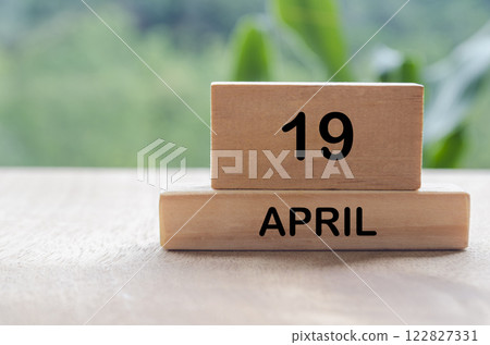 19 April calendar on wooden table with customizable space for text, ideas or messages. Calendar and copy space concept. 122827331