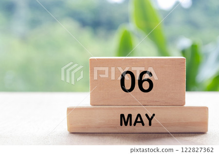 6 May text on wooden blocks with customizable space for text or messages. Month and copy space concept 122827362