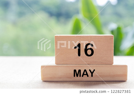 16 May text on wooden blocks with customizable space for text or messages. Month and copy space concept 122827381