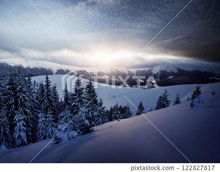 Dairy Star Trek in the winter woods. Mysterious winter landscape majestic mountains in winter Dairy Star Trek in the winter woods. Mysterious winter landscape majestic mountains in winter 122827817
