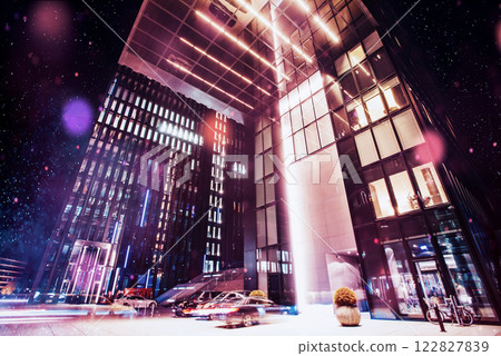 Panorama of the night city of Dusseldorf in winter during a snowstorm. Bokeh light effect, soft filter 122827839