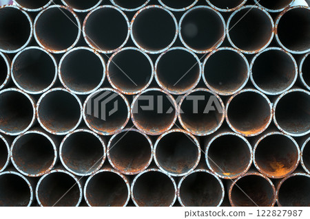 Stacked metal pipes in production. Steel industry and construction Stacked metal pipes in production. Steel industry and construction 122827987
