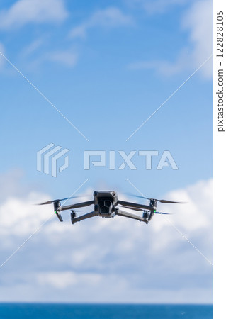 Drone flying on the shore 122828105