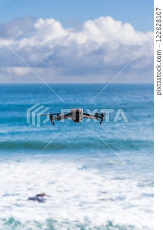 Drone flying on the shore Drone flying on the shore 122828107