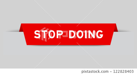 Red color inserted label with word stop doing on gray background Red color inserted label with word stop doing on gray background 122828403