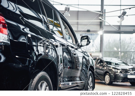 The back headlights of a black luxury car The back headlights of a black luxury car 122828455