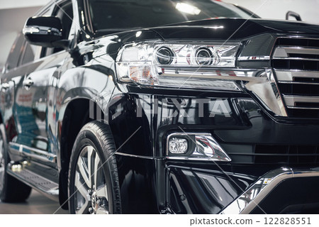 The headlights and the hood of a black luxury car The headlights and the hood of a black luxury car 122828551