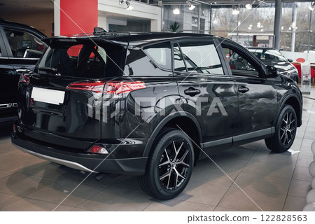 The back headlights of a black luxury car The back headlights of a black luxury car 122828563