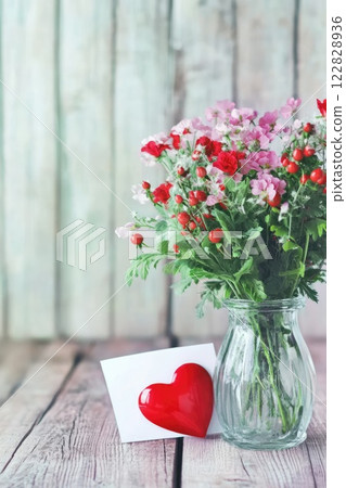 Beautiful bouquet of flowers and love letter greeting card with red heart, Mother's Day, Valentine's day, concept 122828936