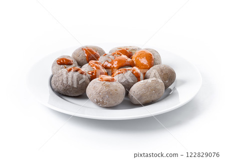 Papas arrugadas with mojo isolated on white background. Traditional Canary Islands food. Papas arrugadas with mojo isolated on white background. Traditional Canary Islands food. 122829076