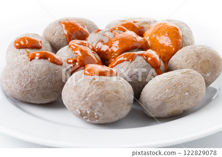 Papas arrugadas with mojo isolated on white background. Traditional Canary Islands food. 122829078